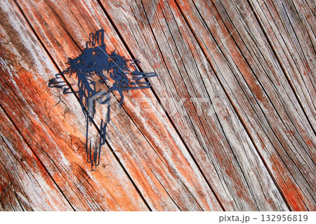 Black Cross Face On Wooden Texture 132956819