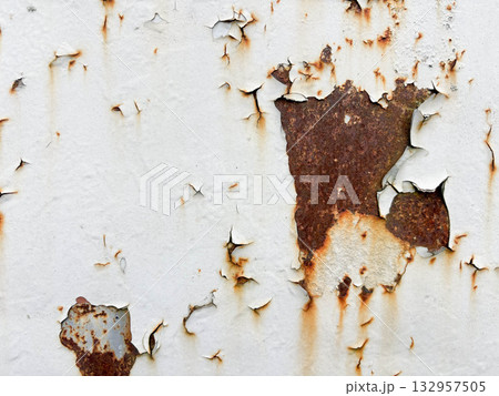 An aged metal surface. Orange-brown rust tones reveal old corrosion. 132957505