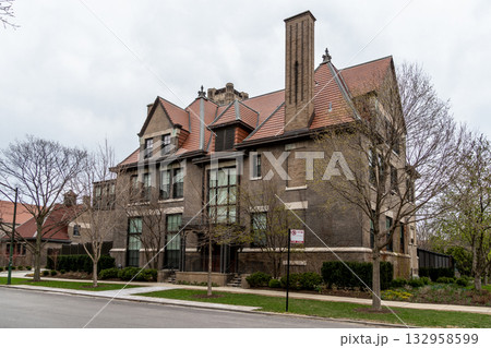The impressive facade of a historic brick building stands tall in a residential Chicago neighborhood. 132958599
