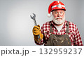 Santa Claus in a hard hat holding a wrench, ready for Christmas repairs 132959237