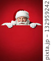 Santa Claus holding a blank red sign 132959242