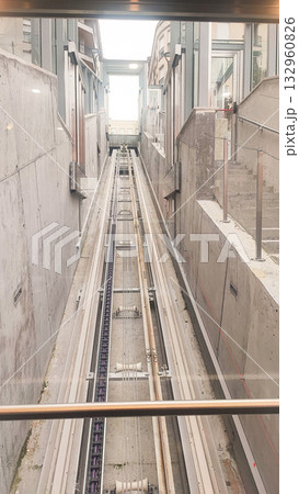 A transparent cable car elevator cabin and mechanism. A concept for modern technology, urban development, and inclusion. 132960826