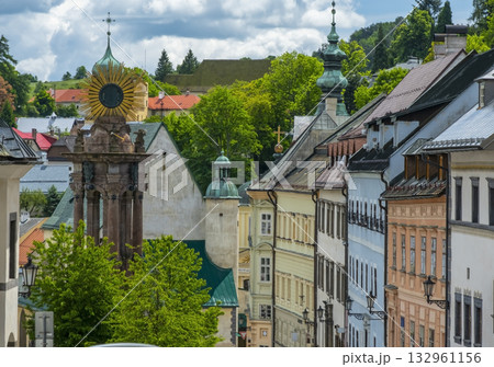 Captivating view of Banska Stiavnica's historic architecture and cobblestone roads under a dramatic sky. This picturesque setting captures the serenity of this historic town Captivating view of Banska Stiavnica's historic architecture and cobblestone roads under a dramatic sky. This picturesque setting captures the serenity of this historic town 132961156