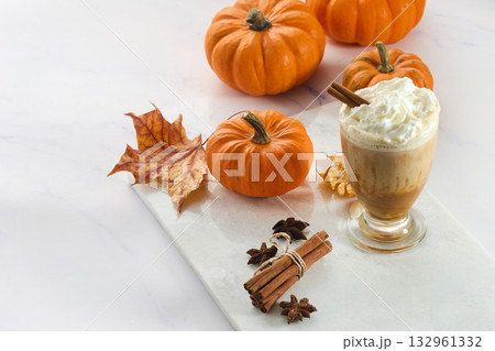 Autumn Pumpkin spice Latte Delight. Pumpkin spice lattes with cinnamon, pumpkin slices, and autumn leaves 132961332