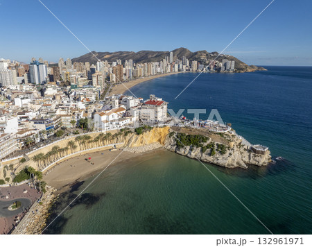 Aerial view of Benidorm, Spain, showcasing high-rise buildings and the Mediterranean Sea in the background. Aerial view of Benidorm, Spain, showcasing high-rise buildings and the Mediterranean Sea in the background. 132961971