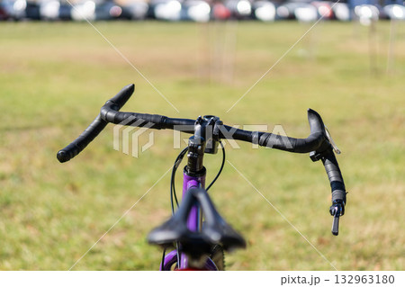 Front view of a road bike handlebar and saddle Front view of a road bike handlebar and saddle 132963180