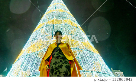 Girl with orange coat at Christmas Girl with orange coat at Christmas 132963942
