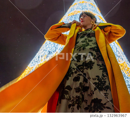 Girl with orange coat at Christmas Girl with orange coat at Christmas 132963967
