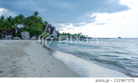 Narrow Tropical Bay of Clear Blue Water Surrounded by Steep Green Hills and Lush Forest Narrow Tropical Bay of Clear Blue Water Surrounded by Steep Green Hills and Lush Forest 132967370
