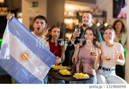 Group of fans in bar with Argentina flag 132968049