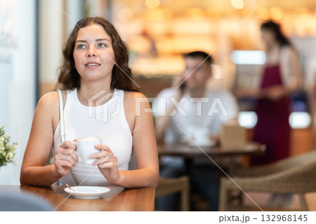 Woman enjoying a cup of coffee in the afternoon 132968145