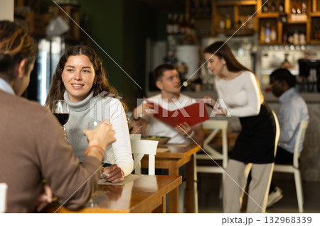 Woman talking to her husband in a restaurant 132968339