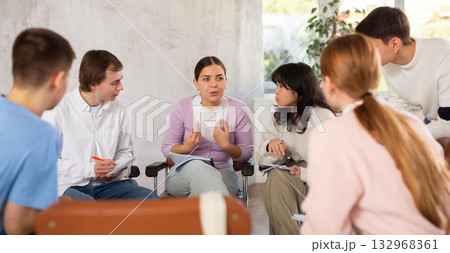 Teenagers communicate with the teacher in a free form during lesson at school Teenagers communicate with the teacher in a free form during lesson at school 132968361