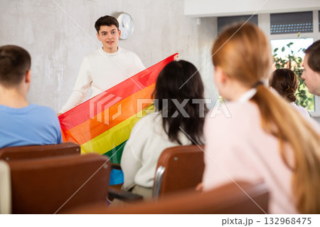 Student talking about LGBT community to groupmates during college class 132968475