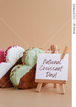 International croissant day saying caption on greeting card Delightful heartshaped pastry croissant treat, beautifully topped with colorful frosting galore. Copy space. Food experimentation viral International croissant day saying caption on greeting card Delightful heartshaped pastry croissant treat, beautifully topped with colorful frosting galore. Copy space. Food experimentation viral 132970695