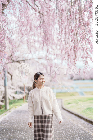 Woman tourist sightseeing Sakura Cherry Blossom in Spring, happy traveler travel in Tendo Park or Maizuru Park in Yamagata prefecture, Tohoku, Japan. famous Landmark for Travel and Vacation 132970961