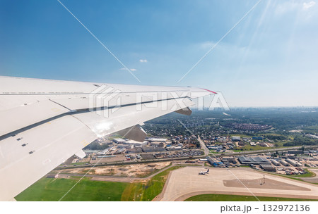 View from the airplane window during takeoff at Sheremetyevo airport at summer View from the airplane window during takeoff at Sheremetyevo airport at summer 132972136