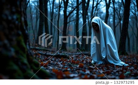 A ghostly figure cloaked in white, standing amidst a forest of bare trees under an overcast sky 132973295