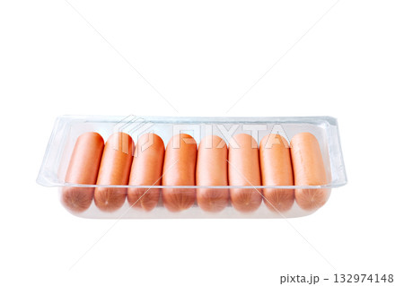 boiled sausages in packaging close up, isolated on white background. boiled sausages in packaging close up, isolated on white background. 132974148