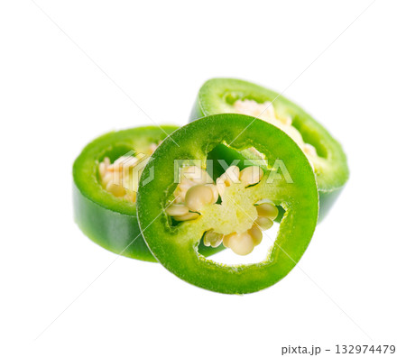 Fresh jalapeno pepper isolated on white background. Slices of green hot serrano pepper. Clipping path. Fresh jalapeno pepper isolated on white background. Slices of green hot serrano pepper. Clipping path. 132974479