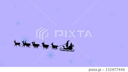 Silhouette of Santa sleigh and eight reindeer flying across lavender backdrop, with blue snowflakes 132977448