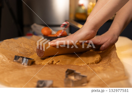 Gingerbread Preparation for Christmas Celebration in a Cozy Kitchen Setting 132977581