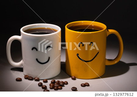 Morning Coffee With Happy Faces Painted on Mugs Brings a Cheerful Day 132977612