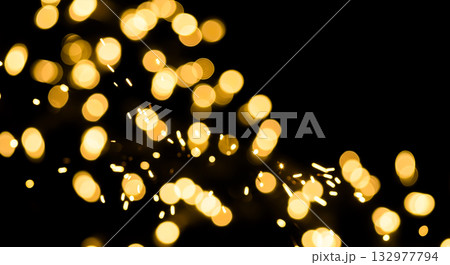 Gold bokeh abstract background, golden blurred lights, christmas glitter, festive holiday texture, new year party, shiny sparkling overlay, dark black backdrop 132977794