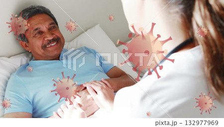 Smiling patient holding caregiver hand on bed at home, with stethoscope and virus icons, copy space Smiling patient holding caregiver hand on bed at home, with stethoscope and virus icons, copy space 132977969