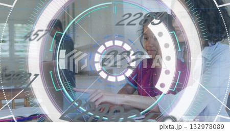Pointing girl in red top interacting with holographic interface in home kitchen, with laptop Pointing girl in red top interacting with holographic interface in home kitchen, with laptop 132978089