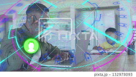 Father in jacket using smartphone, typing on laptop at home, with son writing notebook, AR overlay 132978093