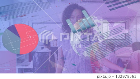 Central woman reviewing analytics in open plan office, with pie chart, bar graph, globe overlays 132978363