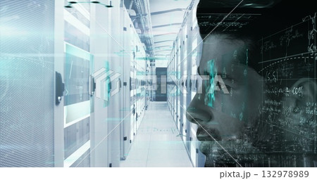 IT engineer examining code streams in data center corridor, with server racks, copy space 132978989