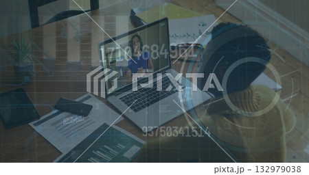 Sitting woman wearing sweater participating in meeting at home desk with laptop, charts, copy space Sitting woman wearing sweater participating in meeting at home desk with laptop, charts, copy space 132979038