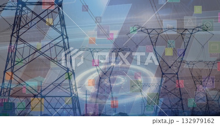 Extending transmission towers and power lines over fields showing colored holographic overlays 132979162