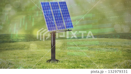 Rotating blue photovoltaic panel on tracking pedestal in meadow in golden haze, with chart overlays 132979331