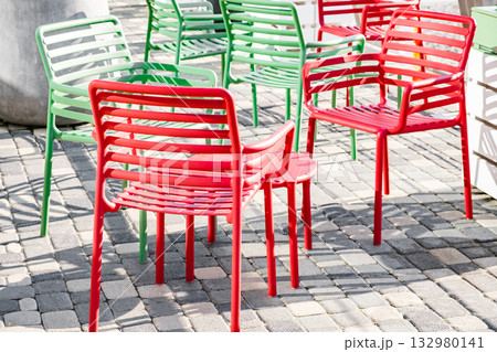 red and green chairs in an outdoor cafe red and green chairs in an outdoor cafe 132980141