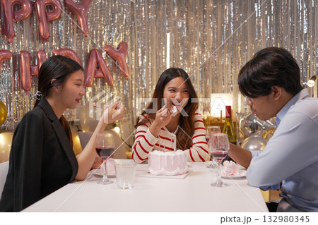 Group of Friends Celebrating Birthday Party with Cake and Gifts Group of Friends Celebrating Birthday Party with Cake and Gifts 132980345