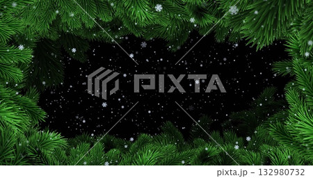 Framing green pine branches forming wreath border in winter graphic, showing falling snowflakes 132980732