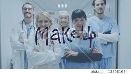 Standing medical team folding arms in hospital corridor, with stethoscopes, lab coats and scrubs Standing medical team folding arms in hospital corridor, with stethoscopes, lab coats and scrubs 132981654