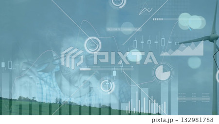 Pondering man wearing shirt studying charts over rural windfarm, with turbine and data overlays 132981788