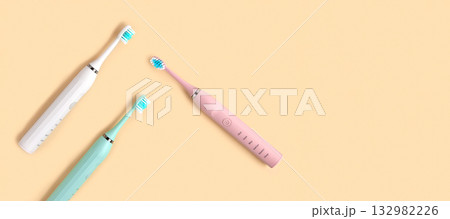 Electric Toothbrush. Top View, Flat Lay, Copy Space. Dental Care Supplies on Beige Pastel Studio Background. Oral Hygiene, Gum Health, Healthy Teeth. Modern Dental Ultrasonic Vibration Tooth Brush Set 132982226