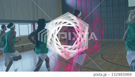 Running basketball team in green jerseys, white shorts doing drills on hall floor, pink overlay 132983069