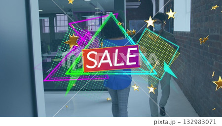 Floating digital neon SALE overlay across office corridor, with masked coworker in blue blouse 132983071