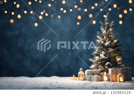 Snow-covered Christmas tree adorned with glowing lights and wrapped gifts. Blue background festive atmosphere with soft snowfall and shimmering bokeh effects. snowy environment, holiday spirit scene. 132983119