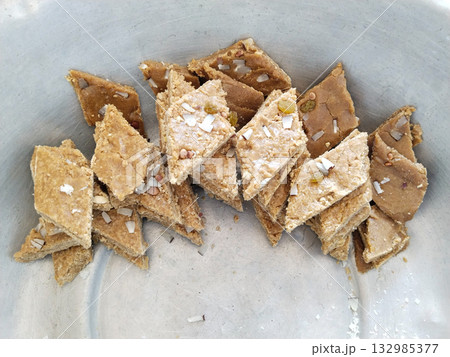 Traditional homemade sweet vermicelli dessert (semai ka halwa) neatly cut and served in a metal container for festive occasion or celebration, shab e barat 132985377