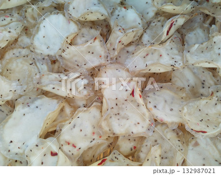 Close-up of homemade sabudana papad drying under sunlight with no background distractions, traditional Indian sago wafers arranged neatly for sun drying Close-up of homemade sabudana papad drying under sunlight with no background distractions, traditional Indian sago wafers arranged neatly for sun drying 132987021