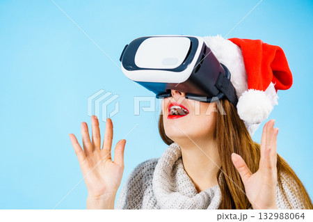 Girl watching 3d film tour in virtual reality glasses. 132988064
