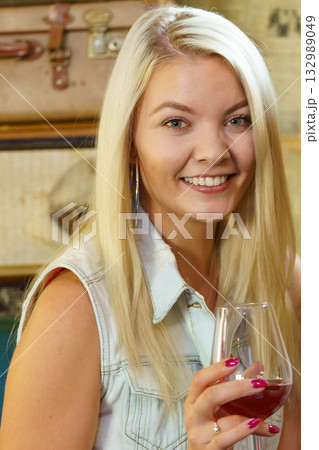 Girl with alcohol glass in pub club 132989049