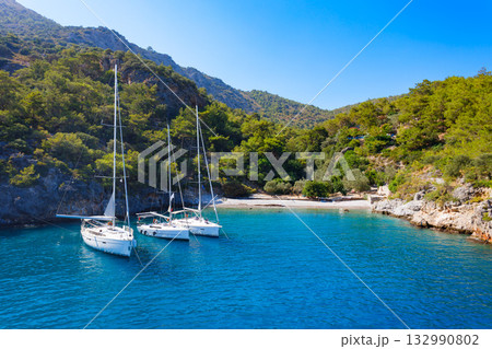 Yachts at the Cold Water Bay near Oludeniz village, Fethiye district in Turkey Yachts at the Cold Water Bay near Oludeniz village, Fethiye district in Turkey 132990802